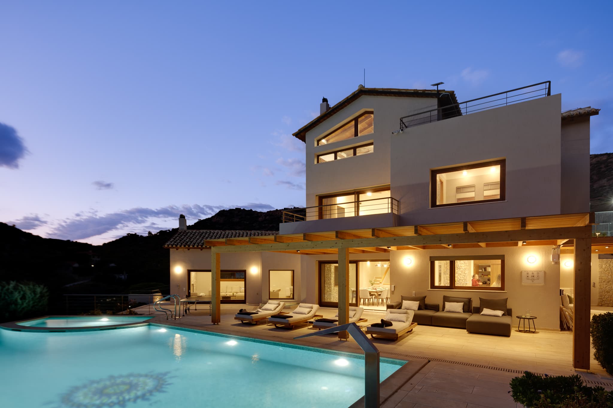 Villa Lithos and the pool under the evening sky