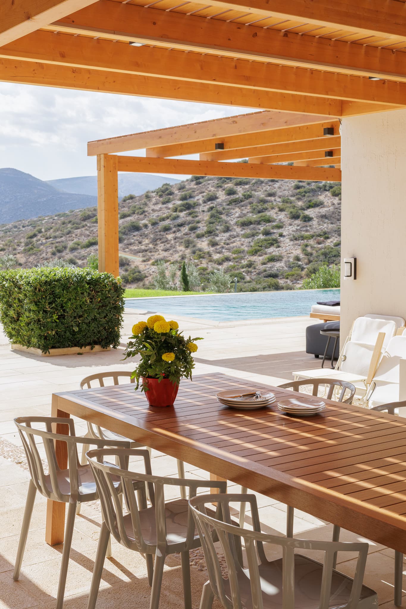Outdoor dining terrace overlooking the pool
